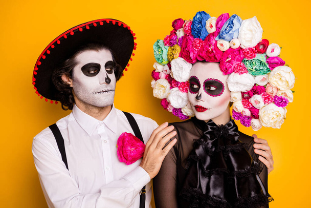 Close-up portrait of his he her she glamorous careful couple embracing spending creepy night calavera catrina festival custom isolated bright vivid shine vibrant yellow color background - Foto, afbeelding