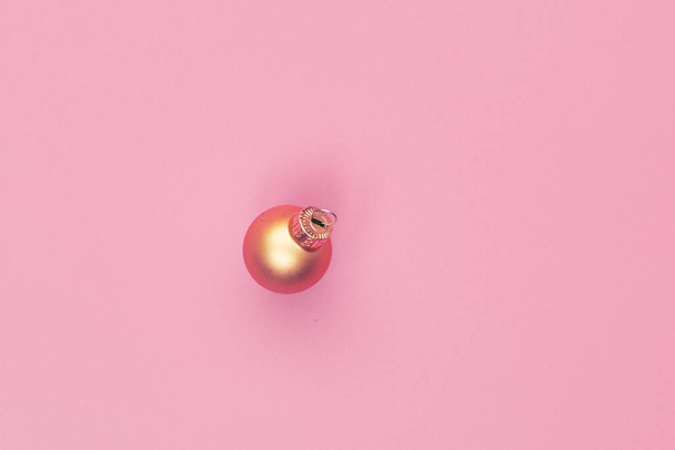 christmas ball on pink background isolate, copyspace, layout - Фото, изображение