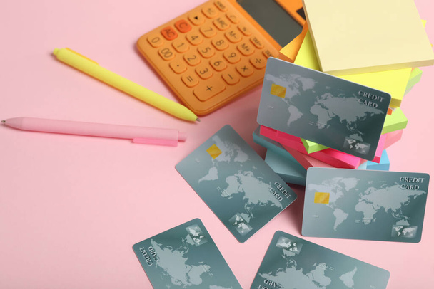Credit cards and stationery on pink background - Photo, Image