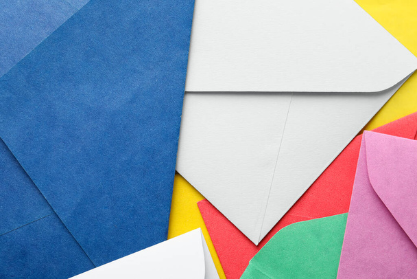 Colorful paper envelopes as background, top view - Foto, Bild