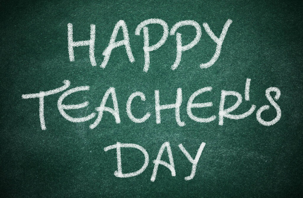 Greeting Happy Teacher's Day on green chalkboard - Photo, image