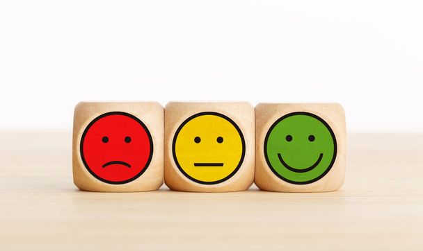 User service feedback, rating customer review, poll, satisfaction survey concept. Wooden blocks with facial expressions - Фото, изображение