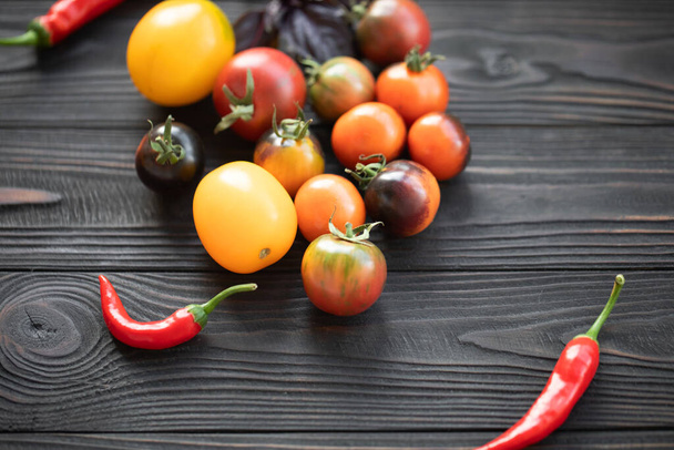 Fresh tomatoes on wooden background. - Фото, зображення