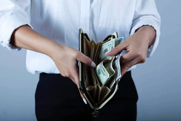 young woman hand money with wallet - Zdjęcie, obraz