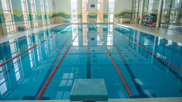 Swimming pool for athletes sports swimming indoor water, daytime shooting water glistens from the sun - Foto, Imagem