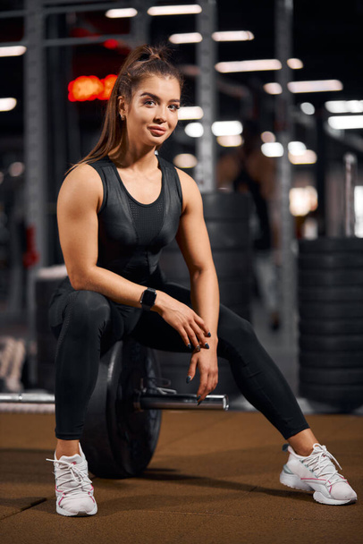 Beautiful model posing in gym - Фото, зображення