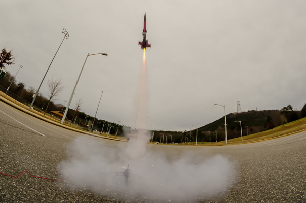 Model rocket launch in parking lot - Photo, Image