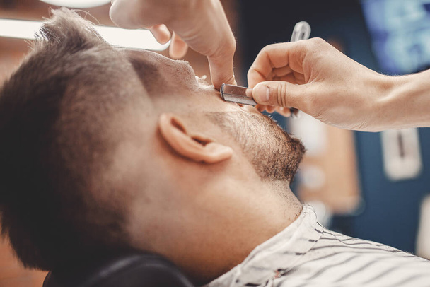 Man hipster having barber shave razor blade barbershop - Photo, Image
