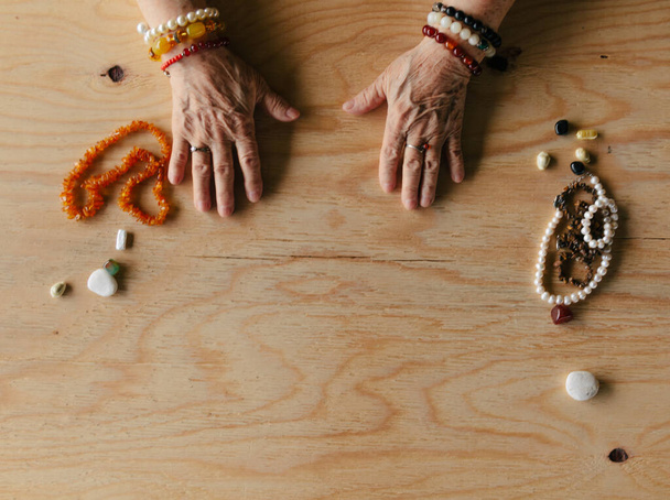 Grandma magic, fortune telling, palmistry. Chiromancy, women hands, destiny reading - Photo, Image