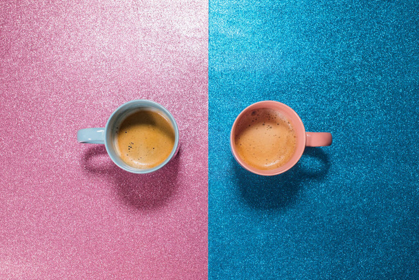 Two cups hot fresh coffee on bright pink blue brilliant paper. Food background. Top view. Flat lay. Minimalism - Photo, image