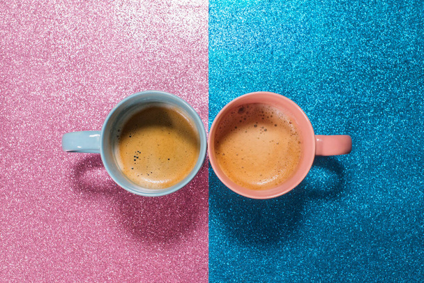 Two cups hot fresh coffee on bright pink blue brilliant paper. Food background. Top view. Flat lay. Minimalism - Fotoğraf, Görsel