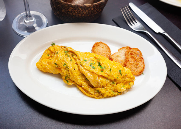 Rolled french omelet with filling of ham, cheese and parsley - Foto, Imagen