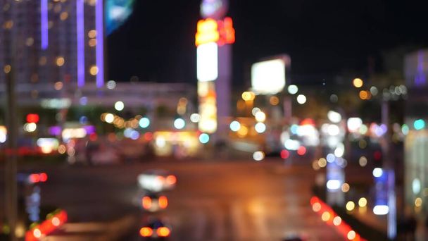 Defocused fabulous Las Vegas Strip boulevard, luxury casino and hotel, gambling area in Nevada, USA. Nightlife and traffic near Fremont street in tourist money playing resort. Neon lights of sin city. - Photo, Image
