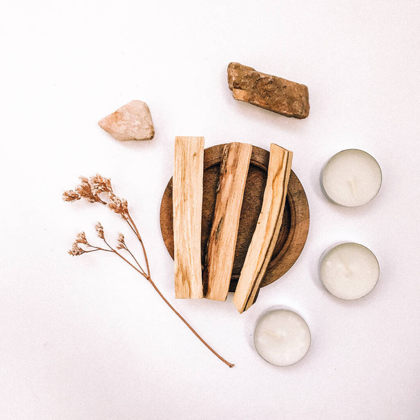 Natural incense White Sage and Palo Santo. Sacred tree of South America, color square photo.White Sage and Palo Santo on white background.  - Foto, afbeelding
