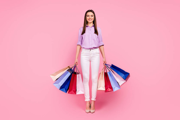 Full length body size view of her she nice attractive lovely fashionable cheerful cheery girl carrying mew things buyings spending weekend time isolated on pink pastel color background - Φωτογραφία, εικόνα
