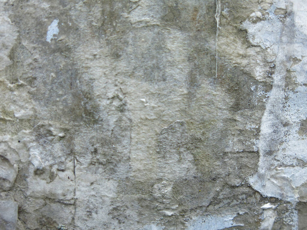dirty rough concrete surface with scratches and scraps of ads, brutal and harsh background - Fotografie, Obrázek
