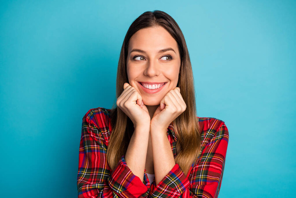 Close-up portrait of her she nice attractive lovely pretty lovable cute cheerful cheery girl wearing checked shirt dreaming looking aside isolated on bright vivid shine vibrant blue color background - Zdjęcie, obraz