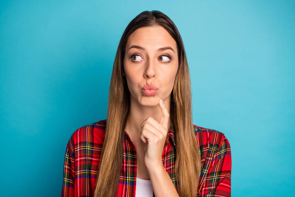 Close-up portrait of nice attractive pretty lovely smart clever girl wearing checked shirt thinking creating guessing plan pout lips isolated on bright vivid shine vibrant blue color background - Fotografie, Obrázek