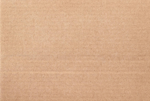 Бурый картонный лист абстрактный фон, текстура рециркуляционной бумажной коробки в старом винтажном рисунке для дизайнерских произведений искусства. - Фото, изображение