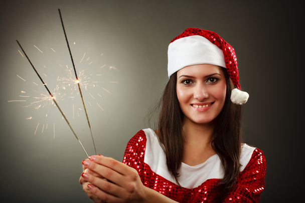 Santa helper with fireworks - Foto, imagen