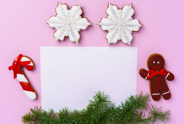 Mock up of holiday greeting card with gingerbread cookies on pink background - Zdjęcie, obraz