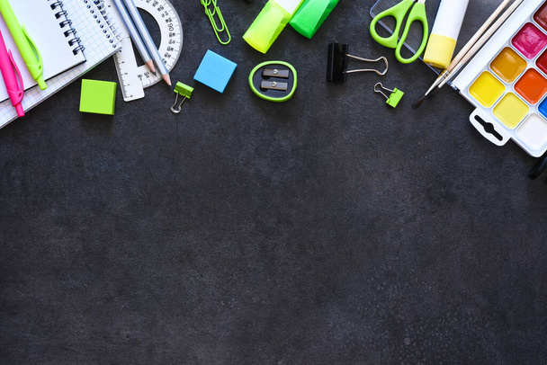 School supplies on a black background. Back to school concept.Flat lay composition with school stationery. - Foto, Bild