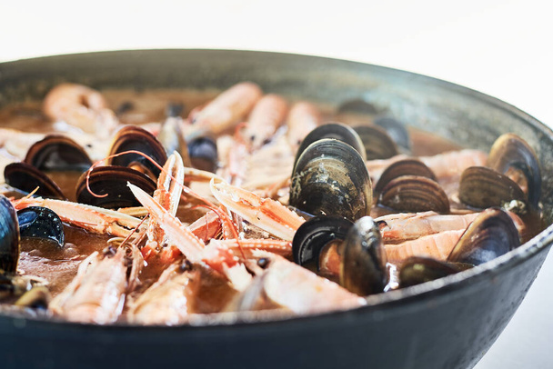 Spanish paella with mussels and prawns - Фото, зображення