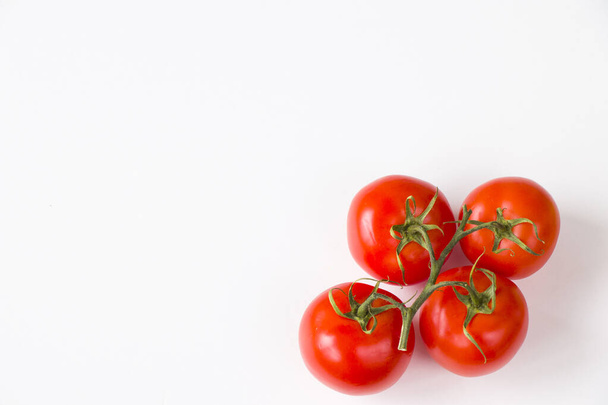 Red four tomatoes on the white background, vegetable - Foto, Imagen