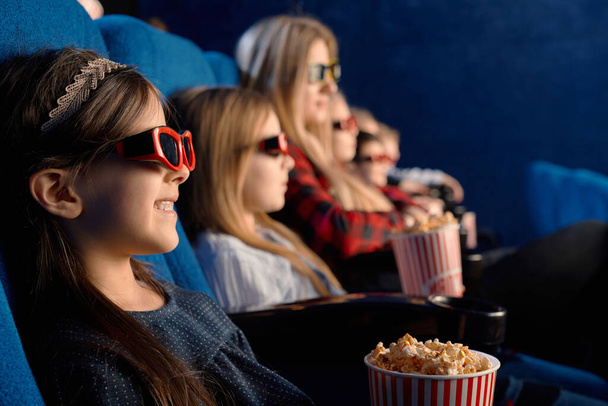 Little friends wearing 3d eyeglasses in cinema. - Valokuva, kuva