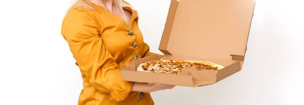 beautiful blond woman eatting piece of pizza - Фото, изображение