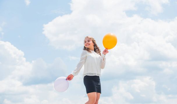 Air balloons for party. Cheerful girl have fun. Summer holidays and vacation. Childhood happiness. Joyful teen celebrate. Play with air. Happiness is simple. Happiness concept. Freedom concept - Φωτογραφία, εικόνα
