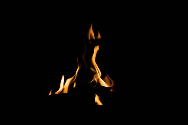 Burning flame of fire on a black background - Foto, afbeelding
