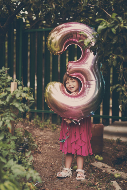 little birthday girl with balloon outdoors - Foto, imagen