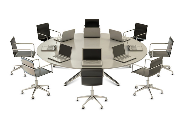 ronde tafel met stoelen en laptops - Foto, afbeelding
