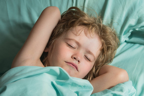 Kids sleep on bed. Small Child rest asleep enjoy good healthy peaceful sleep or nap. - Photo, image