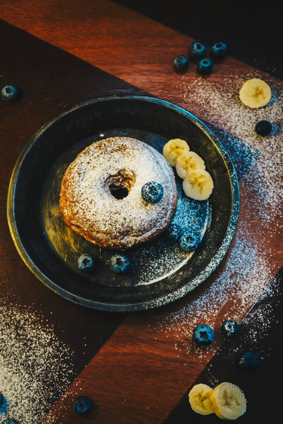 Delightful donut with blueberries and icing - Photo, Image