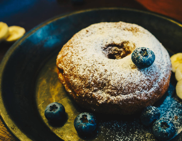 Delightful donut with blueberries and icing - Photo, Image