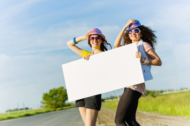 Two girls with banner - Foto, afbeelding