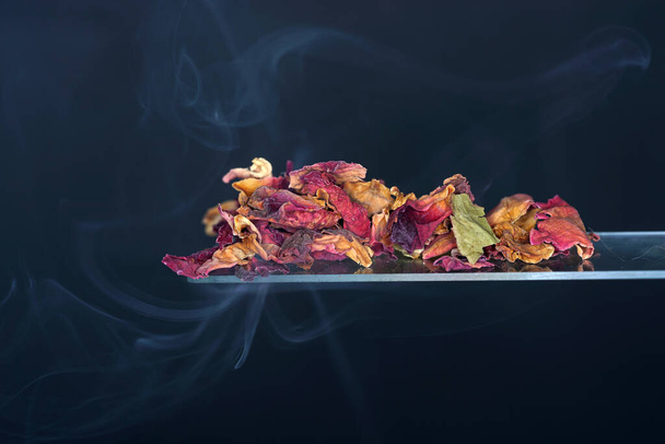 A closuep shot of dry rose petals on glass - Photo, Image