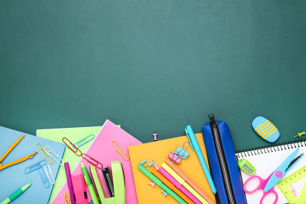Different school supplies on chalkboard background - Photo, Image