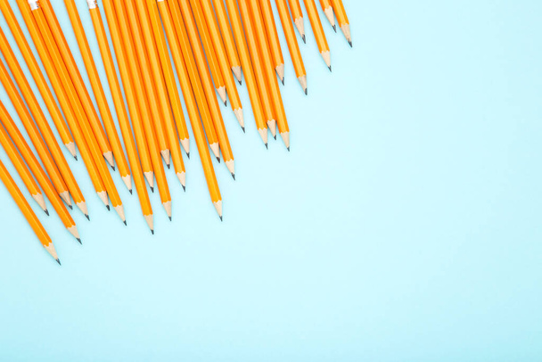 Yellow pencils on blue background - Foto, immagini