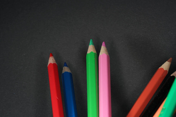 A closeup shot of colorful pencils - Fotó, kép