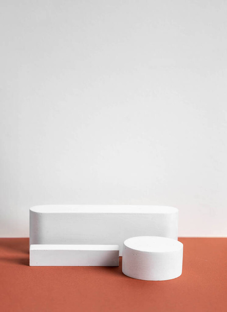 concrete podium on earthy tone background. Pedestal, place for product - Foto, Imagem