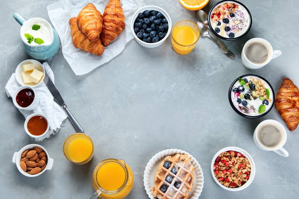 Healthy breakfast with freshly baked croissants on gray background.  Top view, flat lay, copy space. - Photo, image