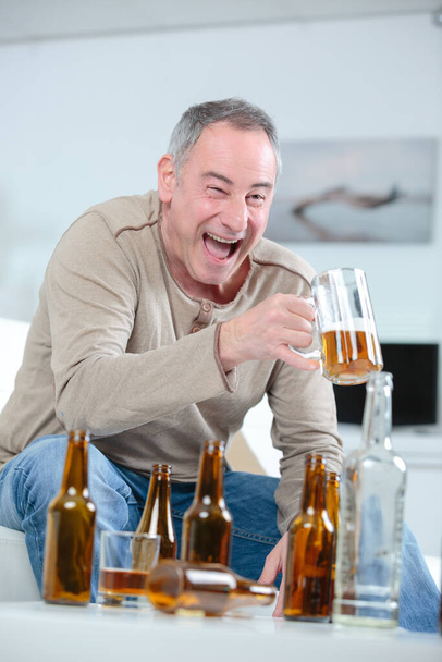 portrait of drunk man at home - Foto, afbeelding