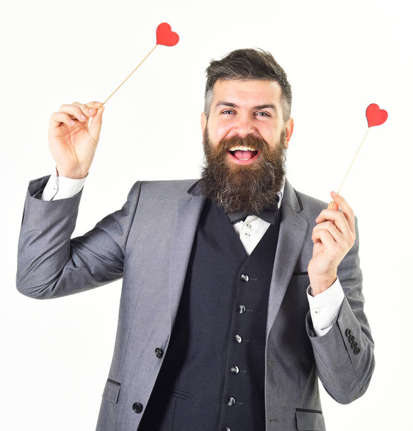 Smart suit concept Bearded man with happy face wears bow tie and smart suit. - Foto, afbeelding