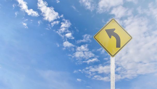 Directional arrow, traffic signs isolated on cloudy bluesky background. - Photo, Image