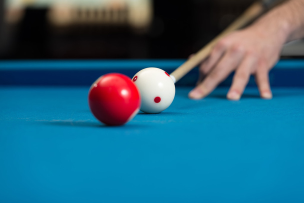 Man Playing Pool About to Hit Ball - Фото, изображение
