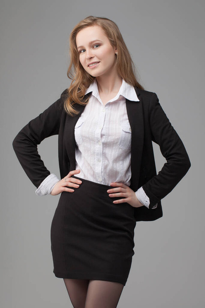 business portrait of smiling woman. on gray background - Fotó, kép