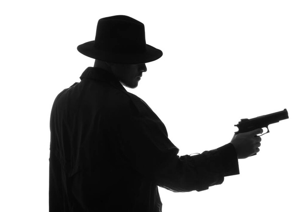 Old fashioned detective with gun on white background - Foto, afbeelding